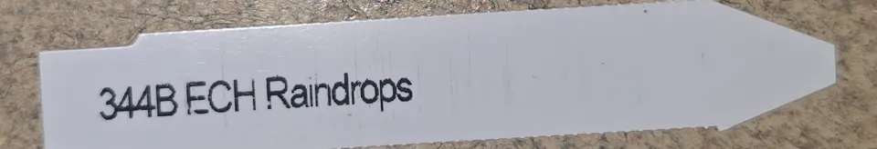 Cropped Mountain Crest seller label for P25 reading Raindrops